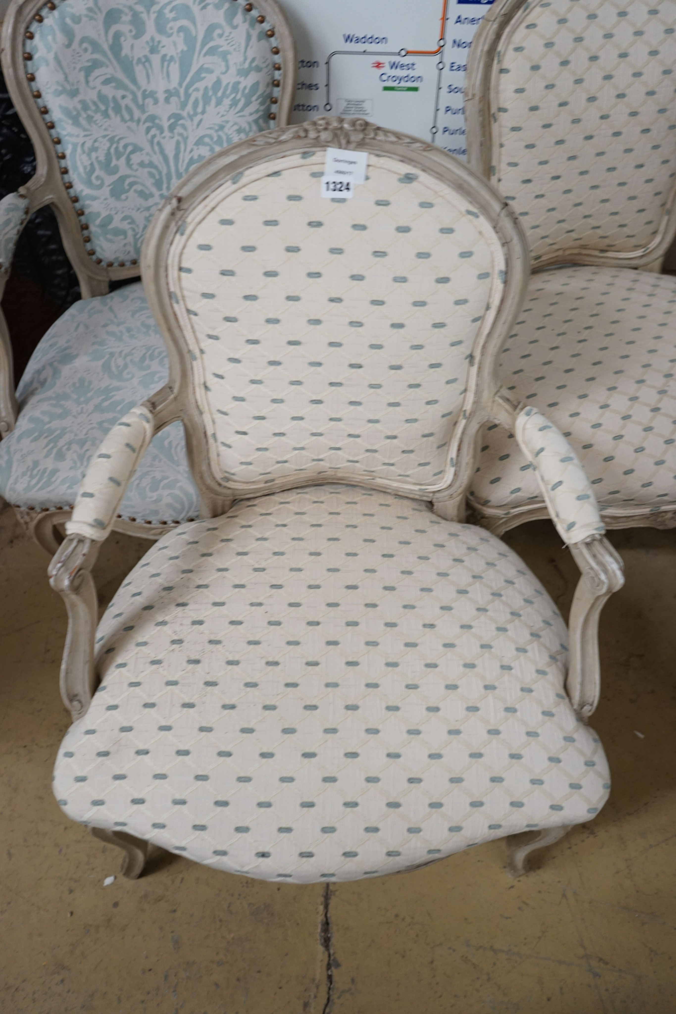 A set of three upholstered French elbow chairs, width 58cm, depth 48cm, height 85cm